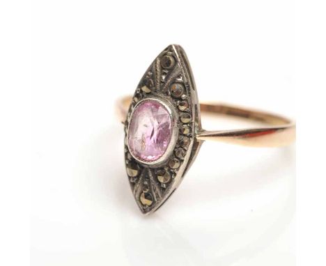 ART DECO FOURTEEN CARAT GOLD DRESS RING
the marquise shaped bezel set with a central oval pink gem surrounded by marcasite, o