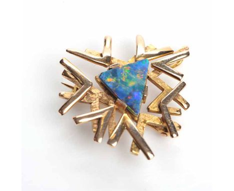 NINE CARAT GOLD OPAL BROOCH
of pierced form, set centrally with a triangular opal section, hallmarked nine carat gold, 7.3gms