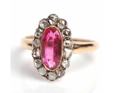 SYNTHETIC RUBY AND DIAMOND CLUSTER RING
c.1890, with a central synthetic oval ruby surrounded by rose cut diamonds, in eighte