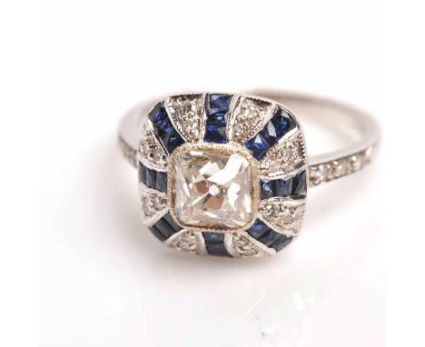 IMPRESSIVE ART DECO SAPPHIRE AND DIAMOND RING
the square bezel set with a central old cut diamond of approximately 1.28 carat