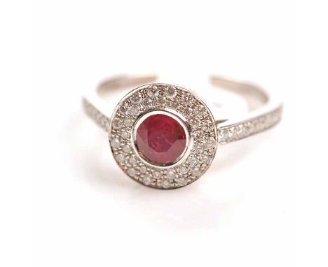 ART DECO STYLE RUBY AND DIAMOND CLUSTER RING
the central round ruby surrounded by diamonds, in eighteen carat white gold, siz