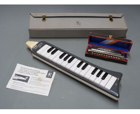 Hohner Melodica 'Piano 26' with original instructions etc and case, together with a Hohner Super Chromatic 12 hole harmonica 