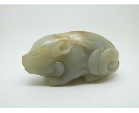 A 19thC Chinese carved jade figure of a recumbent pig, height 4cm x length 7.5cm