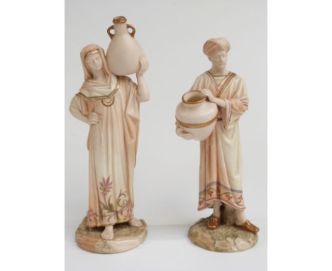 Royal Worcester pair of blush ivory Eastern water carrier figures decorated in blush ivory/shot silk colourway, shape numbers