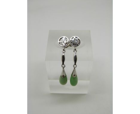 A pair of 14k white gold Chinese earrings with Chinese character studs and tear drop jade section