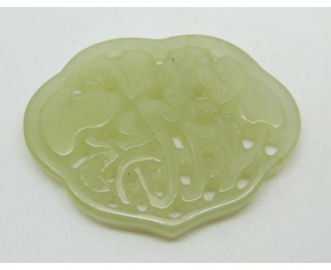 A 19thC Chinese carved and pierced jade plaque with archaic decoration, length 5.8cm