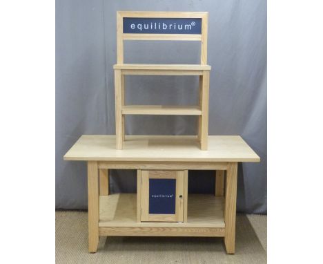 A pine or similar shop display stand with two shelves above the top, the base fitted cupboards and shelf, L137 x W90 x H173cm