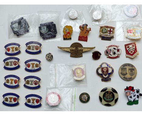 Twenty-nine enamel football badges including Manchester United, Swindon, Arsenal etc