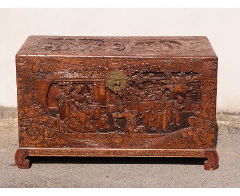 A carved Oriental camphorwood trunk, W104 x D50 x H64cm
