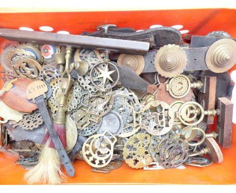 A quantity of Victorian and later horse brasses to include many on pieces of harness including ceramic set examples, swinging