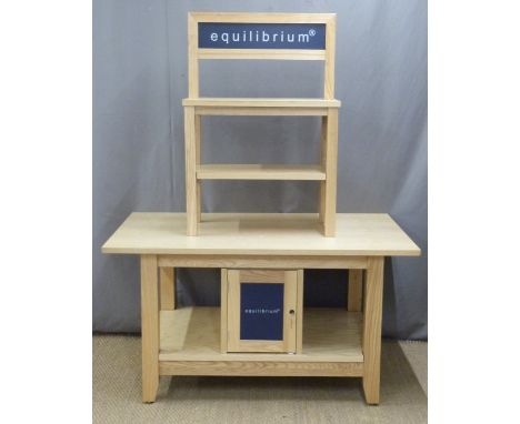 A pine or similar shop display stand with two shelves above the top, the base fitted cupboards and shelf, L137 x W90 x H173cm