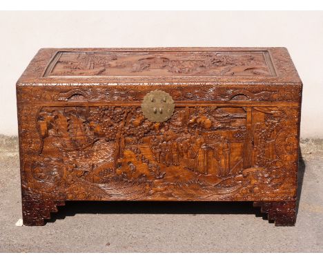 A carved Oriental camphorwood trunk, W101 x D53 x H56cm
