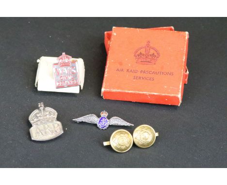 A small group of British World War Two era badges to include silver examples. 