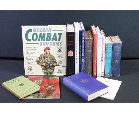 A large collection of military reference books to include Badge, Button, Medal and sword examples. 