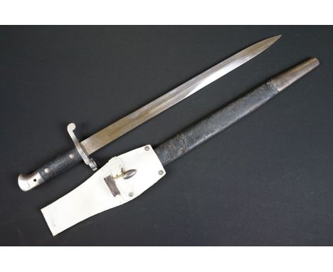 A British bayonet with good clear markings to the blade complete with scabbard and white leather frog. 