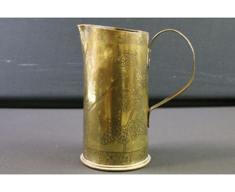 A World War One Trench Art jug made from a spent artillery shell, etched  decoration to the Army Service Corps Ypres 1915-16,