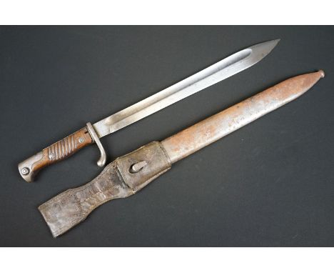 A German Waffenfabrik Mauser Bayonet together with scabbard and frog. 