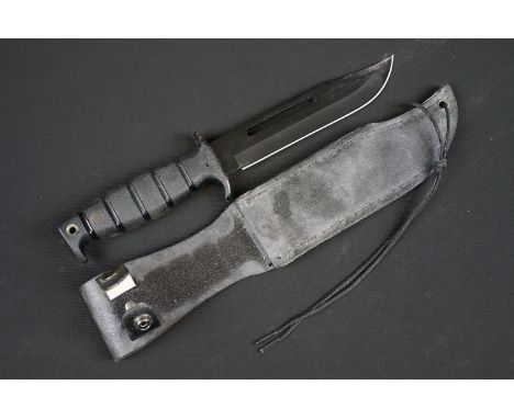 A Contemporary survival knife together with leather scabbard. 