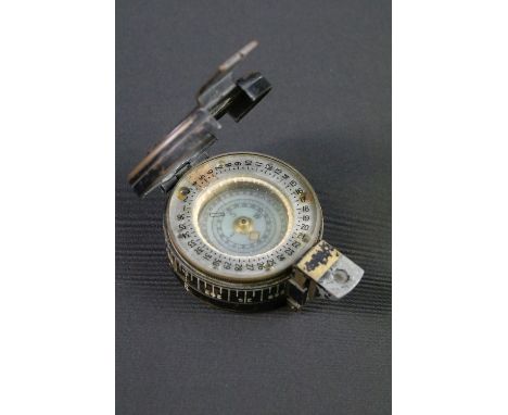 A British World War Two MK.3 marching compass, maker marked for T.G. &amp; Co, dated 1939 and marked with the British broad a
