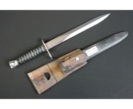 A Swiss SIG 510 7.62 rifle bayonet together with scabbard and frog. 