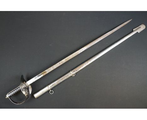 A British military officers dress sword, etched blade with the QEII cypher, complete with scabbard. 