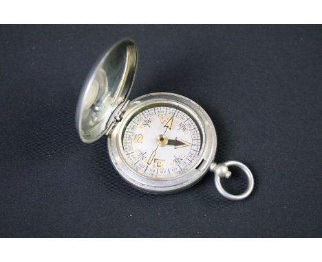 A British military issued World War One pocket marching compass, the case marked Dennison, Birmingham VI, 79597, dated 1918. 
