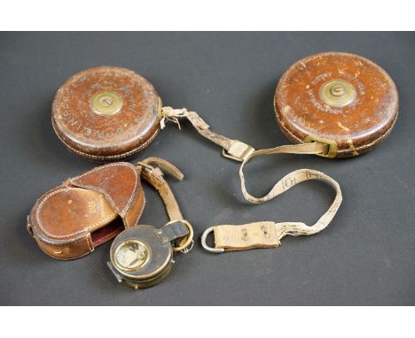 A Brass marching compass within leather fitted case being dated 1916 and broad arrow marked together with a 1916 dated leathe