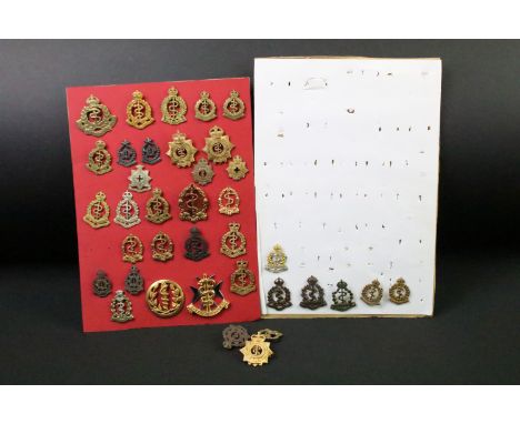 A collection of Commonwealth Royal Army Medical Corps cap and collar badges to include Canadian, Australian and New Zealand e