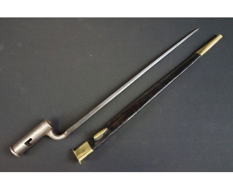 A 1858 pattern brown bess rifle bayonet together with leather scabbard. 