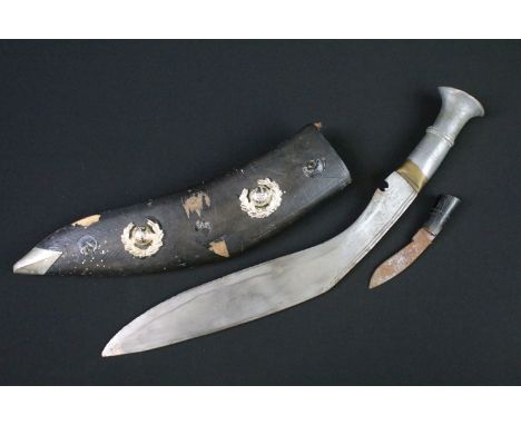 A vintage Gurkha Kukri knife complete with scabbard adorned with two Royal Marines badges. 