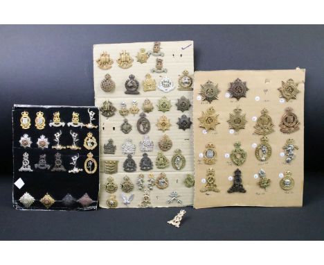 A collection of British military regimental cap and collar badges to include the Army Service Corps, Royal Electrical and Mec