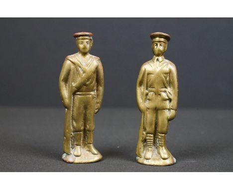 Two World War One brass figures to include Army and Navy examples, possibly trench art. 