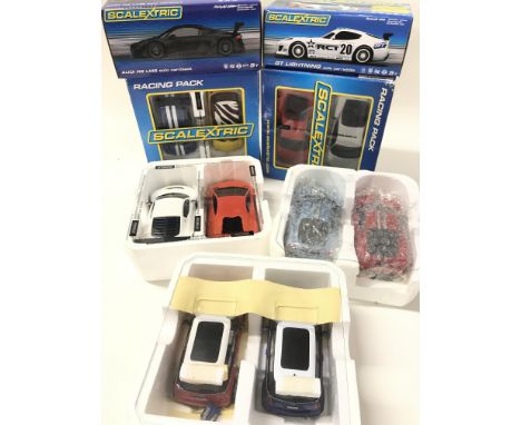 2 X Scalextric Racing Packs. A Boxed Audi R8 LMS. A GT Lightning and other Cars.