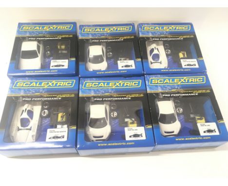 A collection of 6 boxed Scalextric pro performance car assembly kit all unstarted.