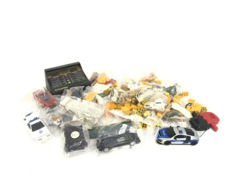 A box containing various Scalextric accessories. No reserve.