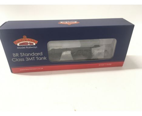 A boxed 00 gauge model locomotive by bachmann 31.980. BR Standard Class 3MT 82020. BR green late crest weathered. 8DCC. No re