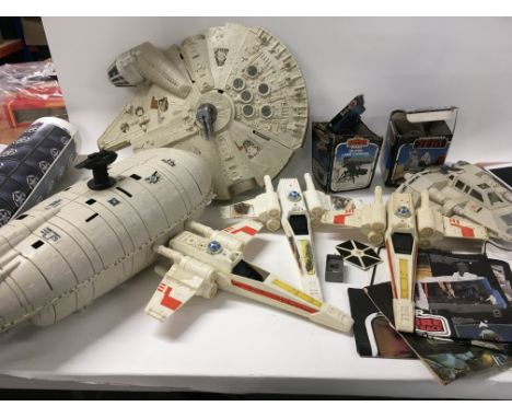 A collection of Vintage Star Wars ships and mini rigs. Also includes leaflet and comic.