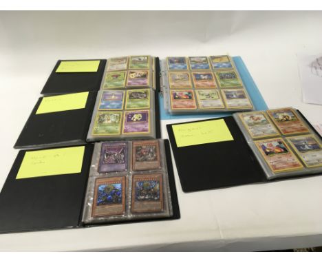 A collection of 5 albums containing PokÃ©mon cards . album 1 contains Jungle Rocket.. album 2 contains Fossil.. album 3 conta