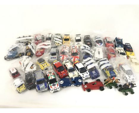 A collection of approximately 30 Scalextric cars. Plus some accessories and spares. No reserve.