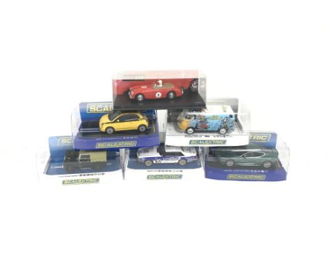 6 boxed Scalextric cars. To include Aston Martin DBS. Jaguar XJS. Land Rover Series 1. Fiat Cinquecento. VW panel Van T1B. Au