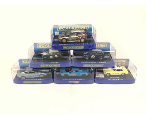 6 boxed Scalextric cars. To include limited edition MGB. McLaren MP4. Aston Martin DBS. Morris Mini. Mini Neptune. Ford Fiest