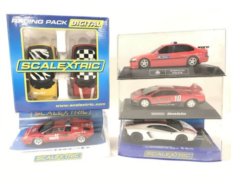 4 Boxed Scalextric cars and a Racing Pack. A Lamborghini Countach. A Lamborghini Aventador LP 700-4. And Others.