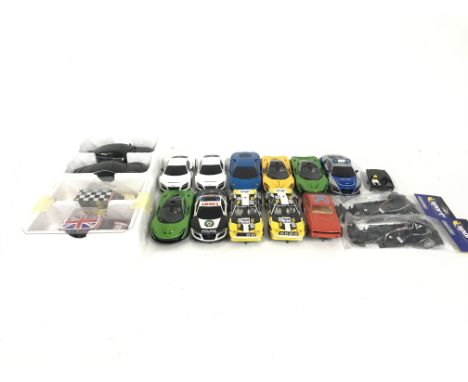 A collection of 15 Scalextric cars. Plus some spare parts. No reserve.