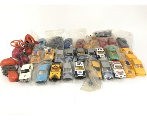 A bag containing a collection of Scalextric cars. Also included some spare parts. No reserve.