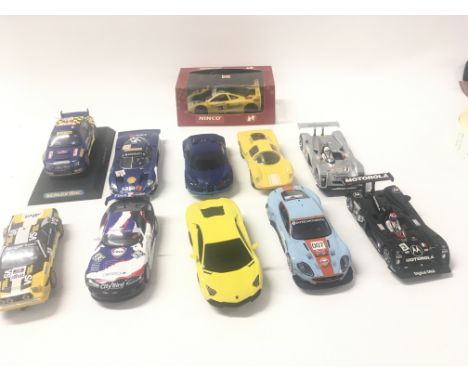 A collection of 10 Scalextric cars and 1 boxed Ninco car.
