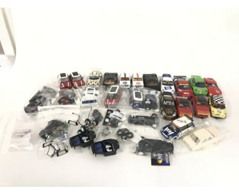 A box containing approximately 20 Scalextric cars. Plus various spares and accessories. No reserve.