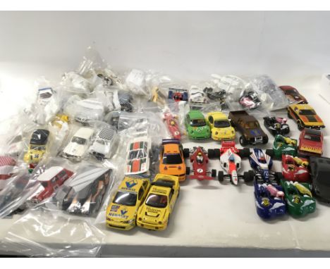 A collection of Scalextric cars..spares and accessories. No reserve
