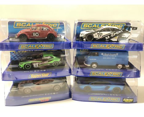 6 Boxed Scalextric Cars. A Volkswagen Beetle. A BMW Z4. A Aston Martin DBR9. A Bentley Continental GT3. A Volkswagen Panel Va