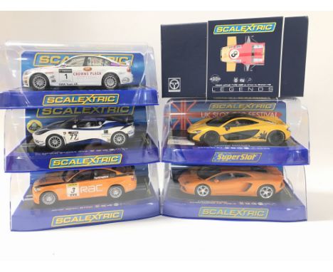 6 Boxed Scalextric Cars including BMW 320SI WTCC. A Lotus Evora GT4. A BMW 320SI BTCC. A McLaren P1(Limited Edition). A Lambo