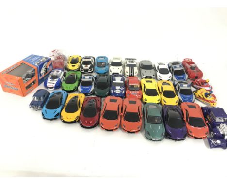 A box containing a quantity of used Scalextric cars. Also to include a quantity of spare parts. Many new. No reserve.